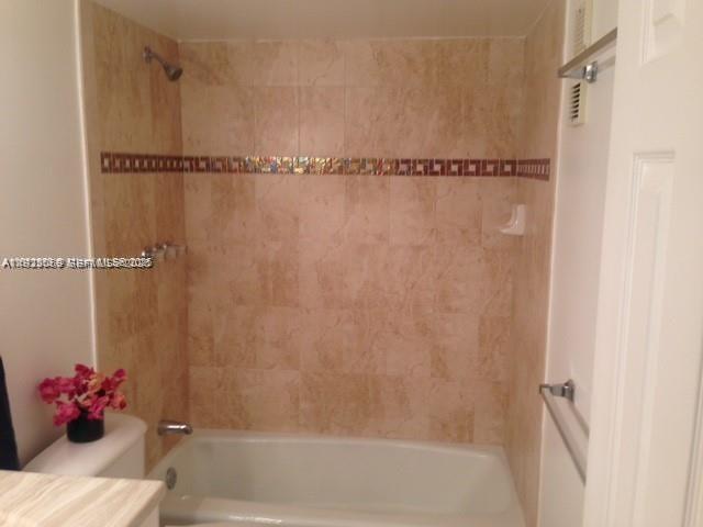 3910 Inverrary Boulevard, Unit 304B Lauderhill, FL 33319 - Photo 6 of 17 a bathroom with a shower and a shower