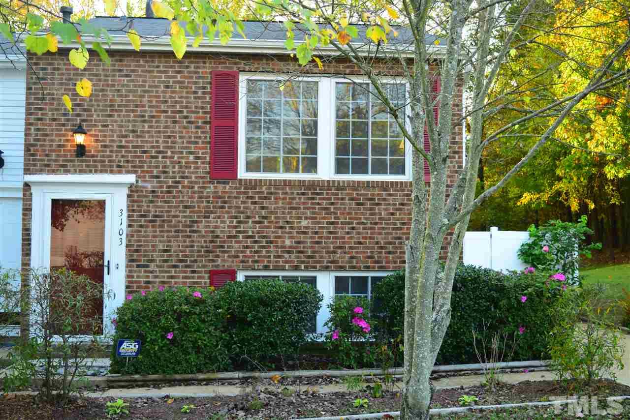 3103 Quinley Place Raleigh, NC 27604 - Photo 1 of 18 a view of a house with brick walls and potted plants