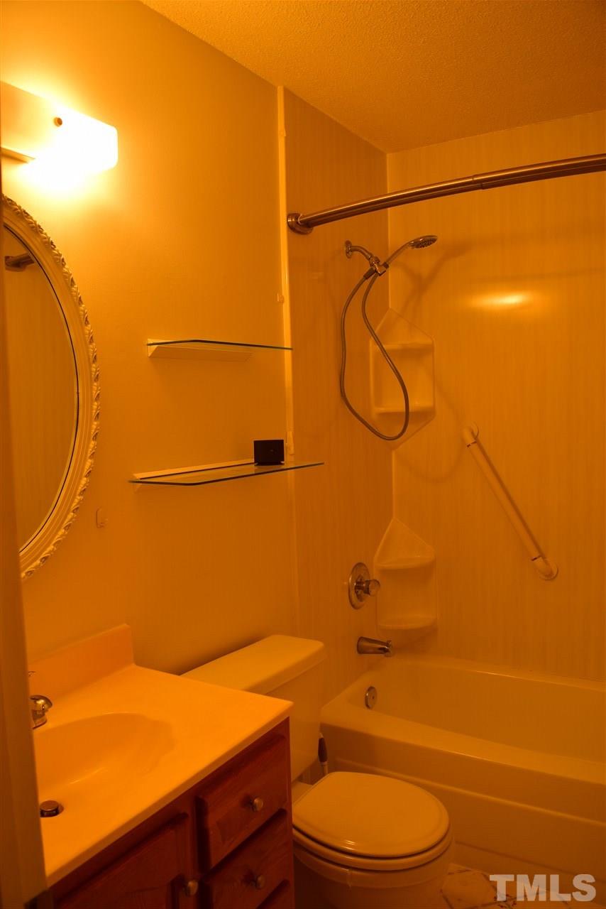 3103 Quinley Place Raleigh, NC 27604 - Photo 18 of 18 a bathroom with a toilet and a shower
