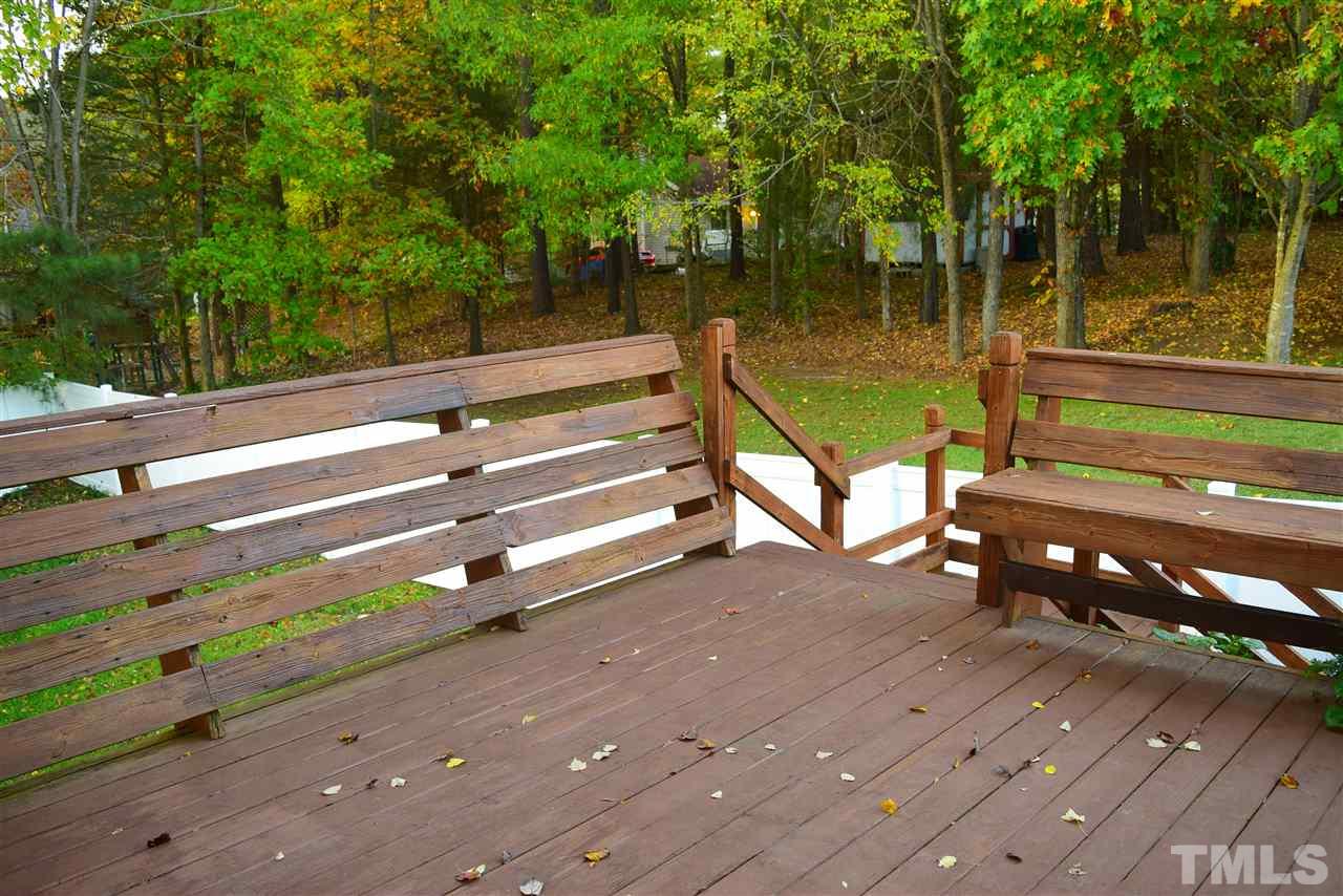3103 Quinley Place Raleigh, NC 27604 - Photo 5 of 18 a view of a bench in a backyard
