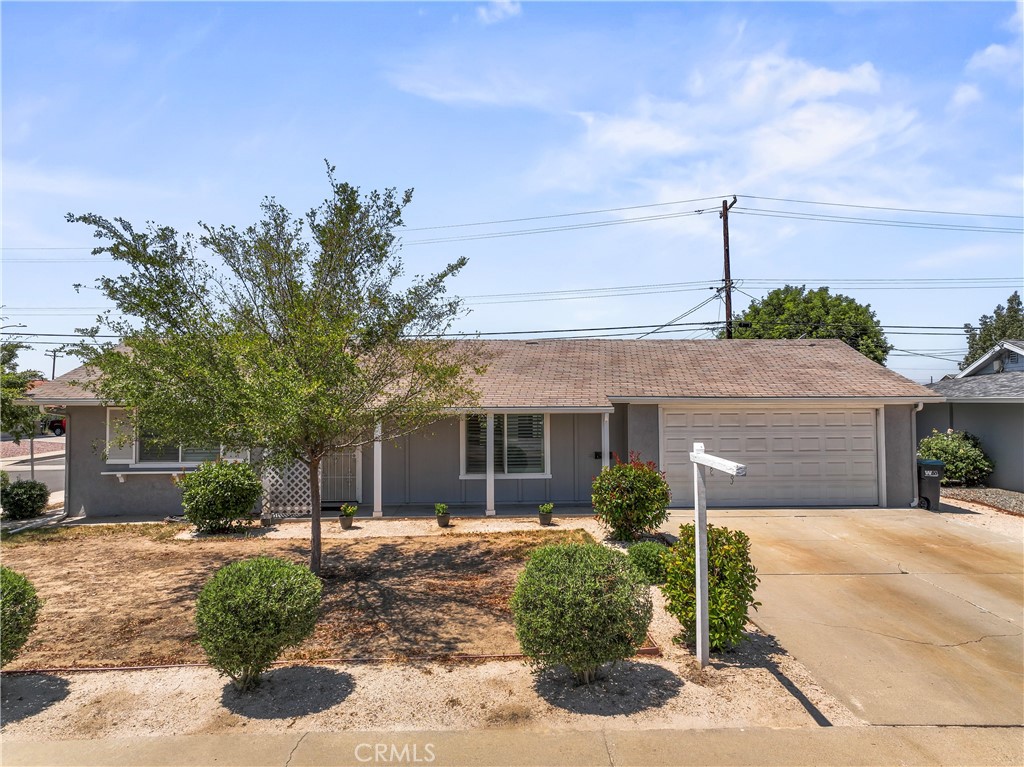 29171 Pebble Beach Drive Menifee, CA 92586 - Photo 2 of 3 a front view of a house with garden