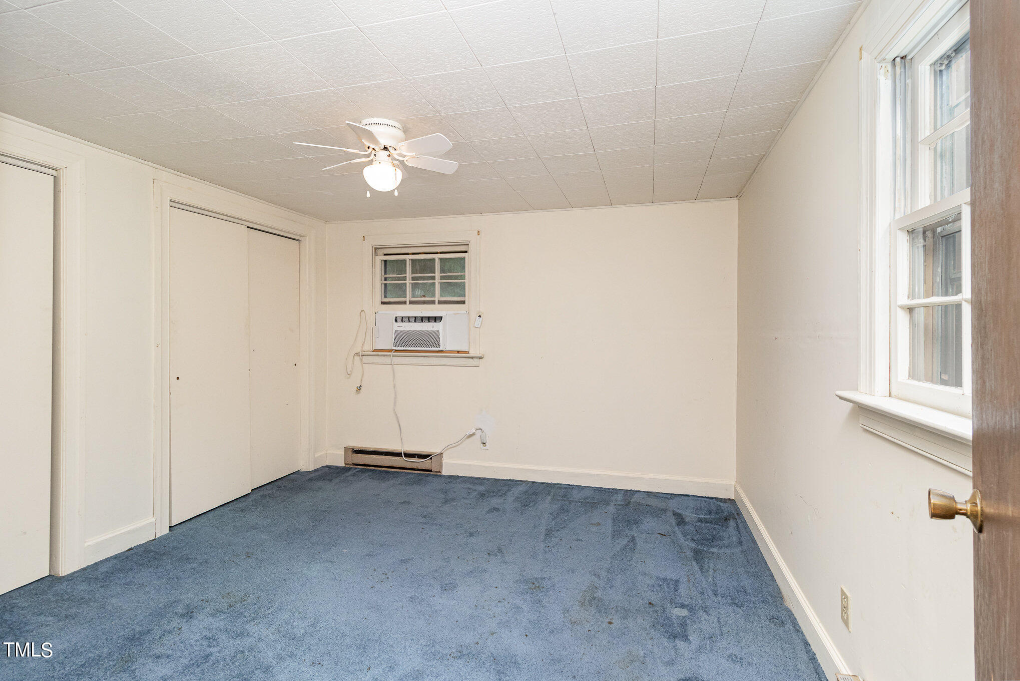 7538 Leonard Road Kenly, NC 27542 - Photo 25 of 32 wooden floor in an empty room with a window