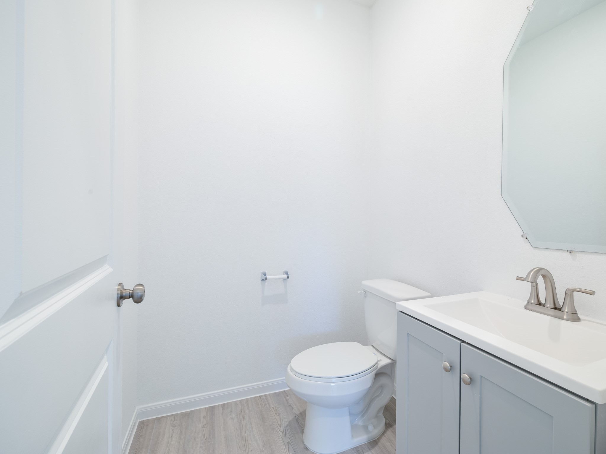 14984 Rustic Moon Road Conroe, TX 77302 - Photo 11 of 20 a bathroom with a sink a toilet and vanity