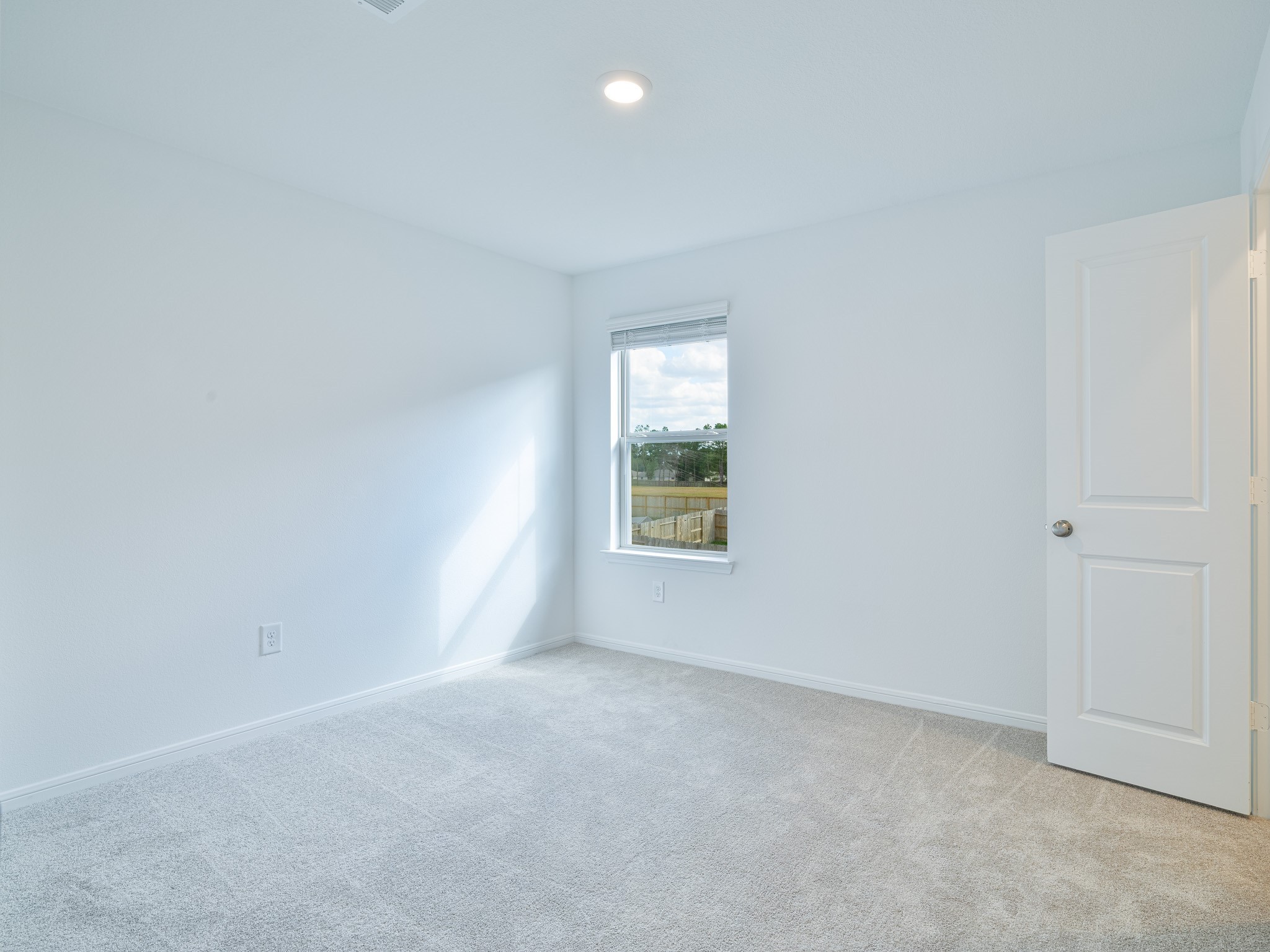 14984 Rustic Moon Road Conroe, TX 77302 - Photo 15 of 20 an empty room with a window