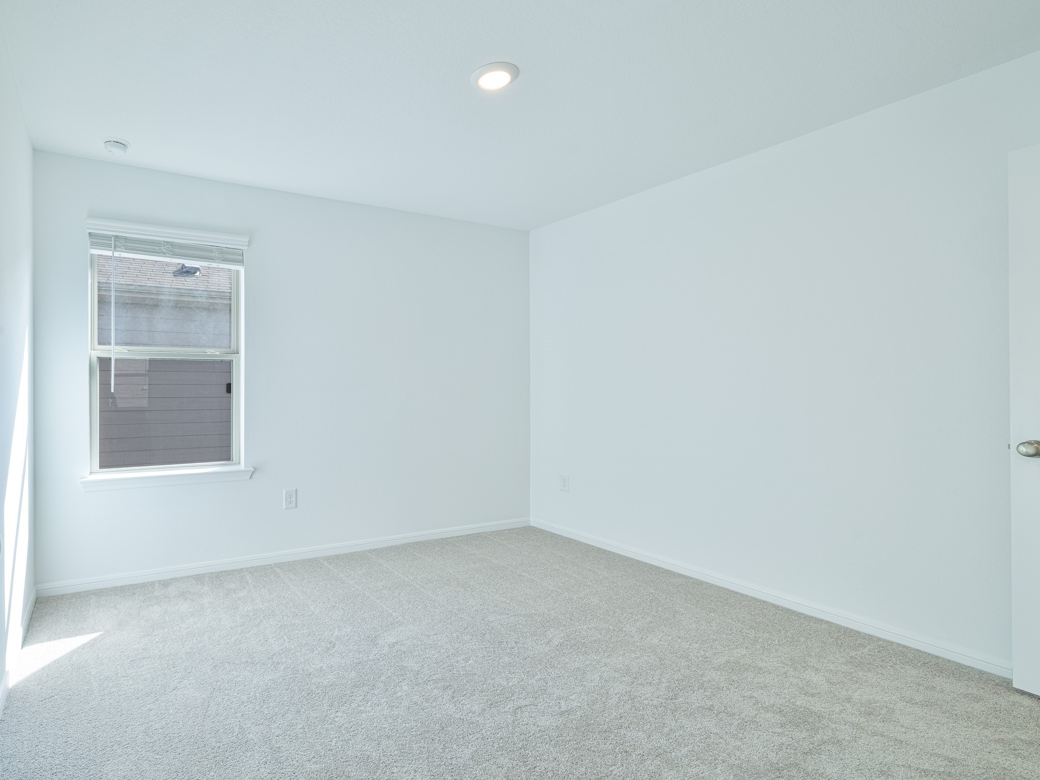 14984 Rustic Moon Road Conroe, TX 77302 - Photo 16 of 20 an empty room with a window