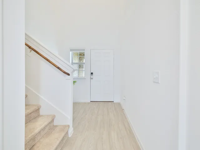 a view of a hallway with staircase