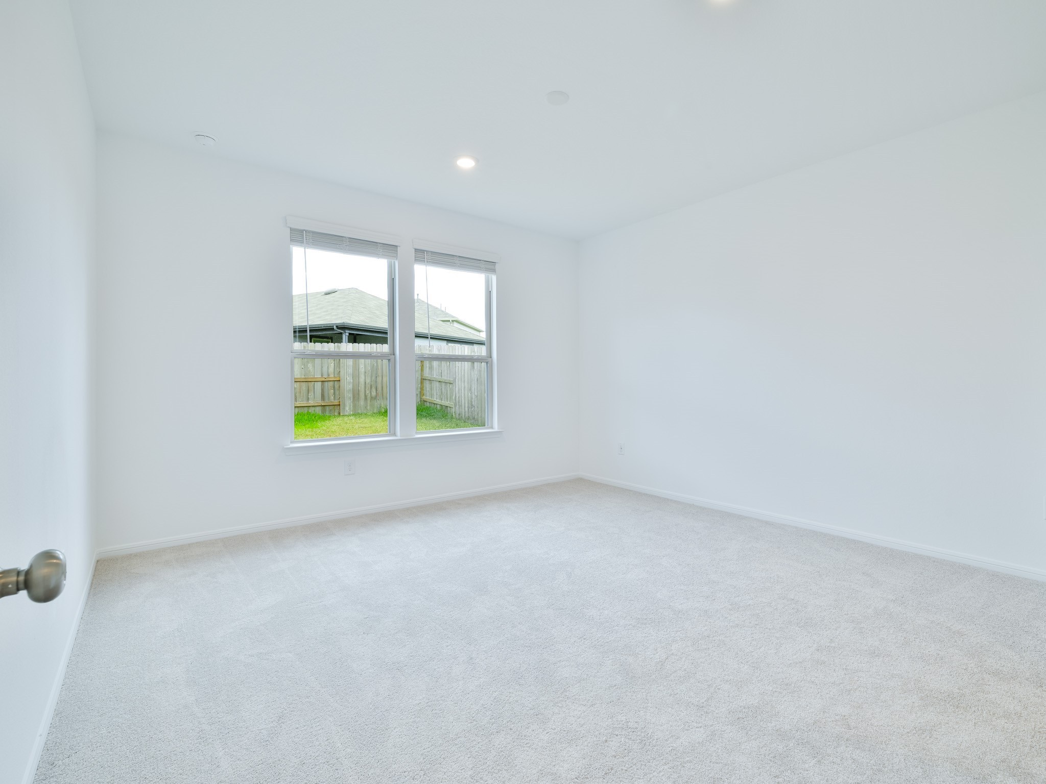 14984 Rustic Moon Road Conroe, TX 77302 - Photo 7 of 20 an empty room with windows