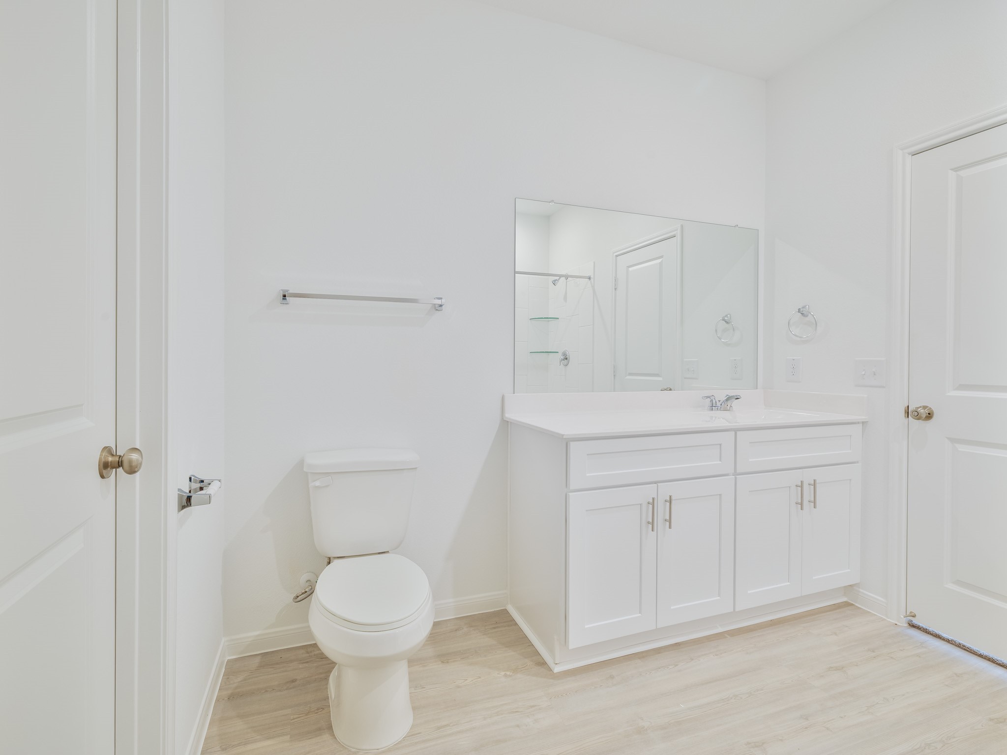 14984 Rustic Moon Road Conroe, TX 77302 - Photo 9 of 20 a bathroom with a toilet sink and mirror