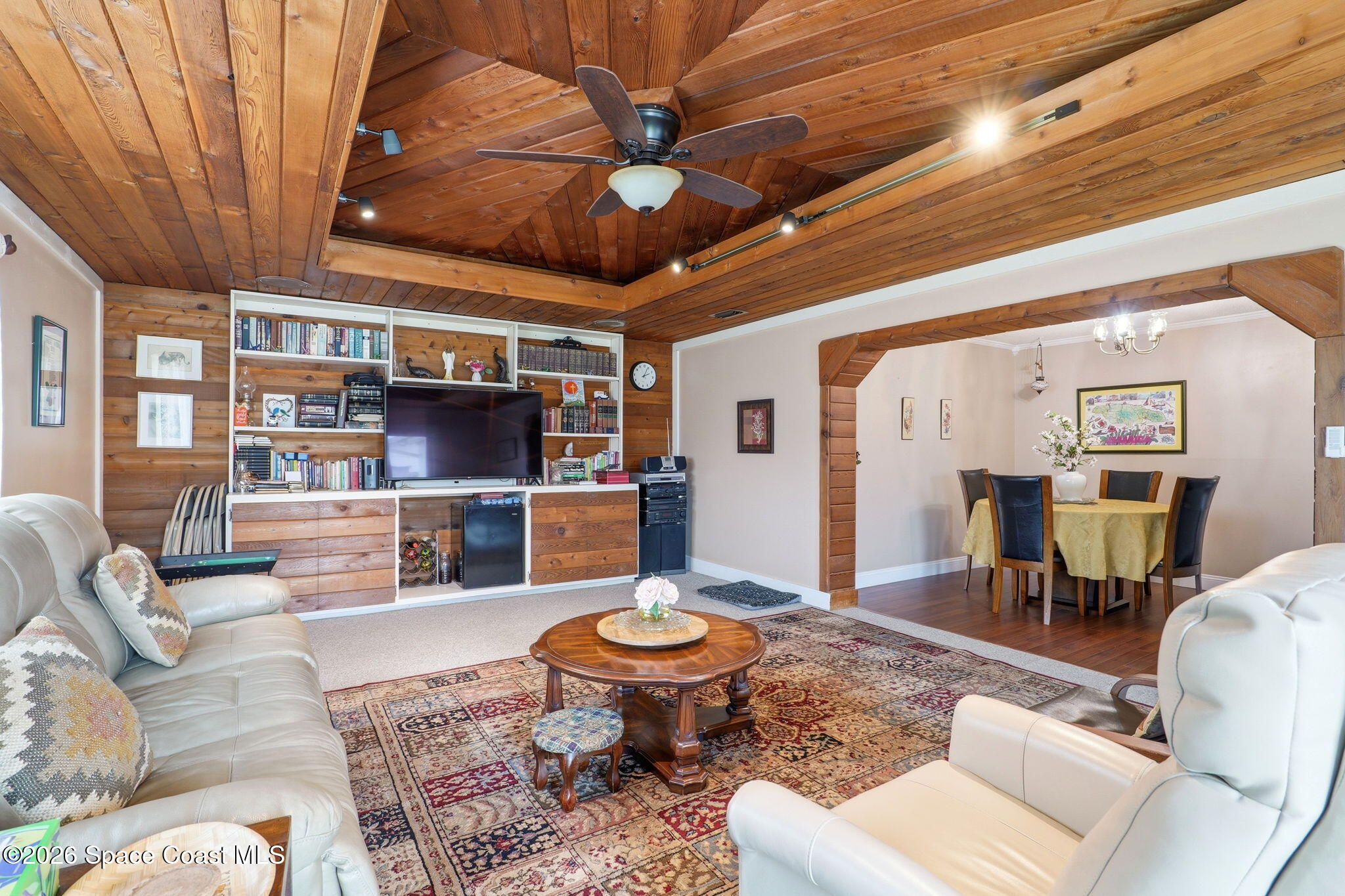 908 Jefferson Road Rockledge, FL 32955 - Photo 4 of 37 a living room with furniture and a view of kitchen