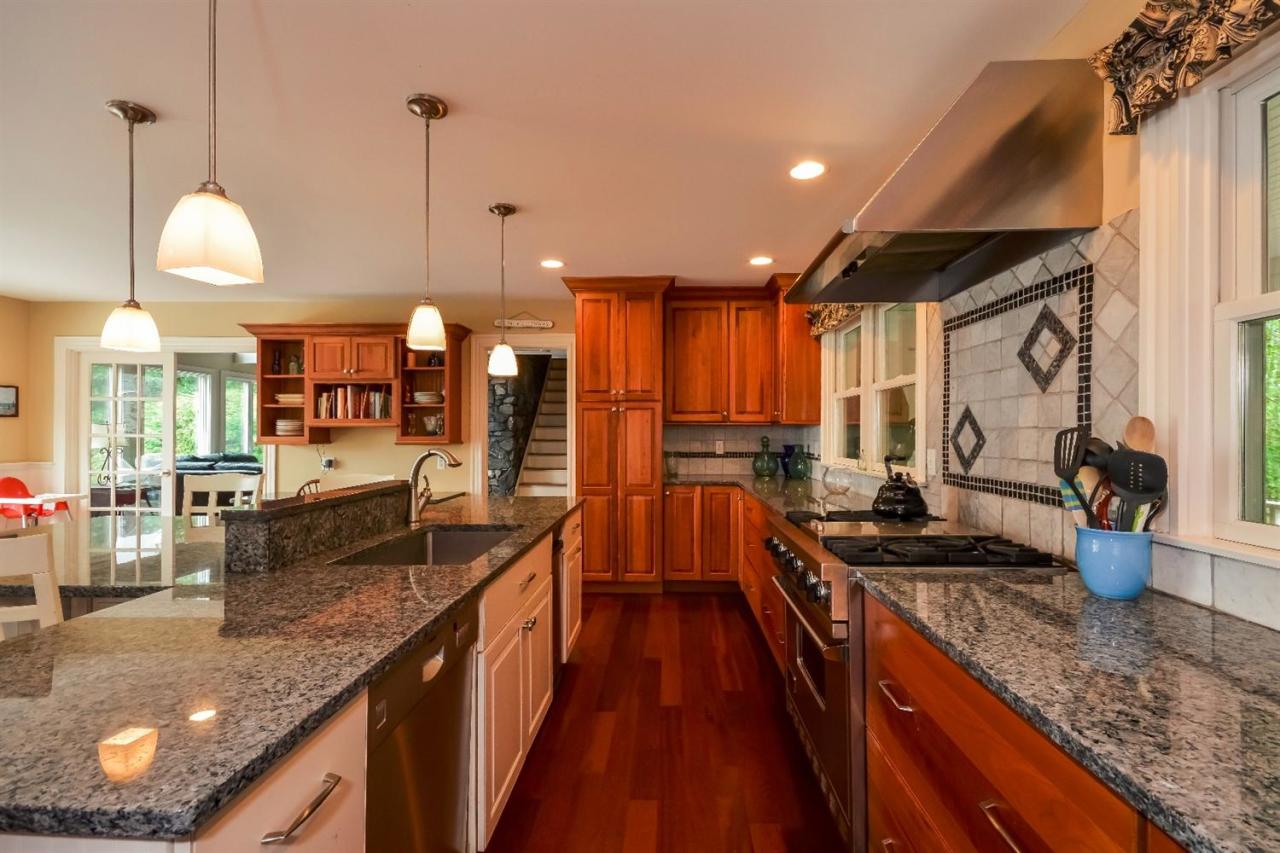 40 Catskill Road Buzzards Bay, MA 02532 - Photo 13 of 35 a kitchen with lots of counter top space and wooden floor