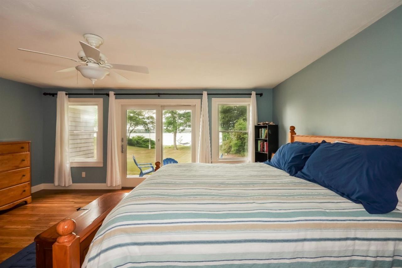 40 Catskill Road Buzzards Bay, MA 02532 - Photo 18 of 35 a bedroom with a large bed and a large window