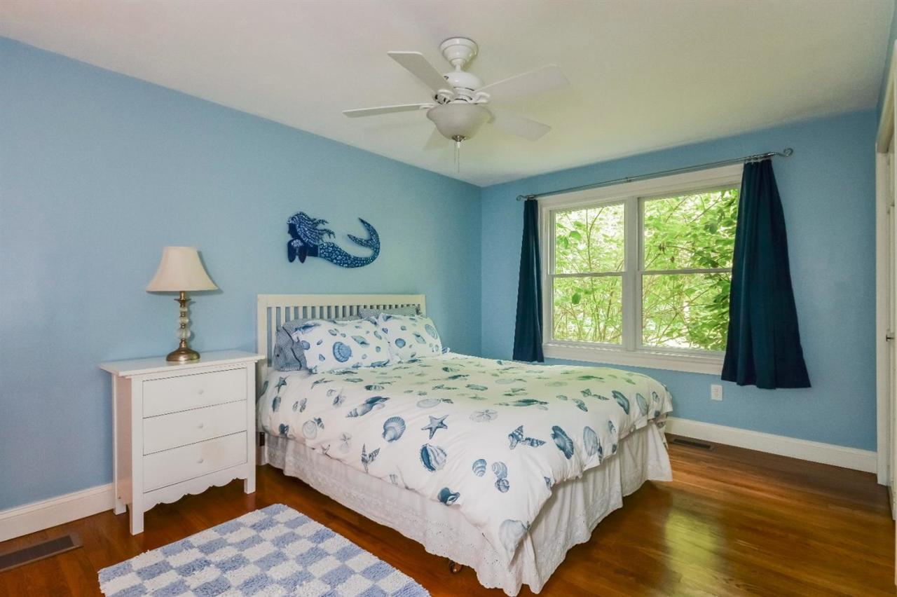 40 Catskill Road Buzzards Bay, MA 02532 - Photo 19 of 35 a bedroom with a bed and a window