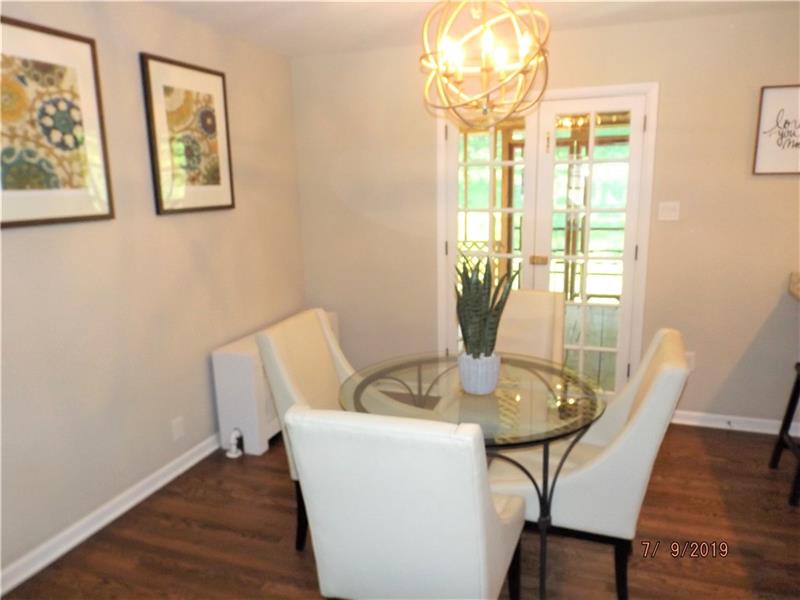 115 Spring Grove Road Penn Hills, PA 15235 - Photo 4 of 25 Dining Room with Hardwood floor and French Doors to rear covered screened porch.