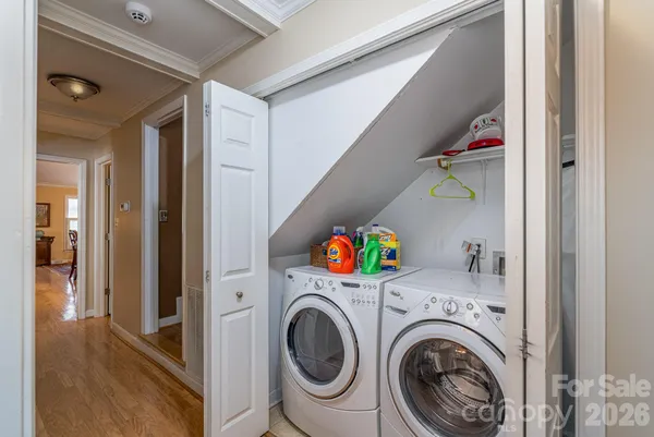 a view of a porch with furniture and wooden floor