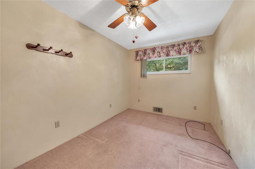283 McCoy Road McKees Rocks, PA 15136 - Photo 19 of 25 a view of a room with a ceiling fan and window