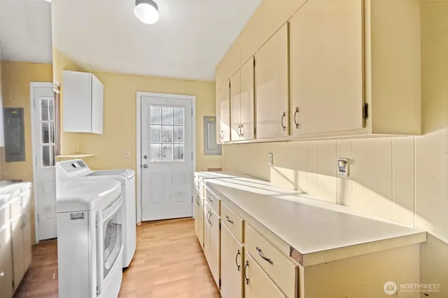 a bathroom with a sink a vanity and a bathtub