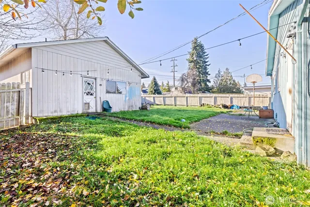 a view of a house with a yard and plants