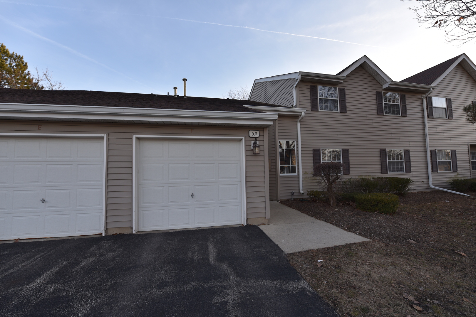 59 Gant Circle, Unit F Streamwood, IL 60107 - Photo 2 of 18 front view of a house