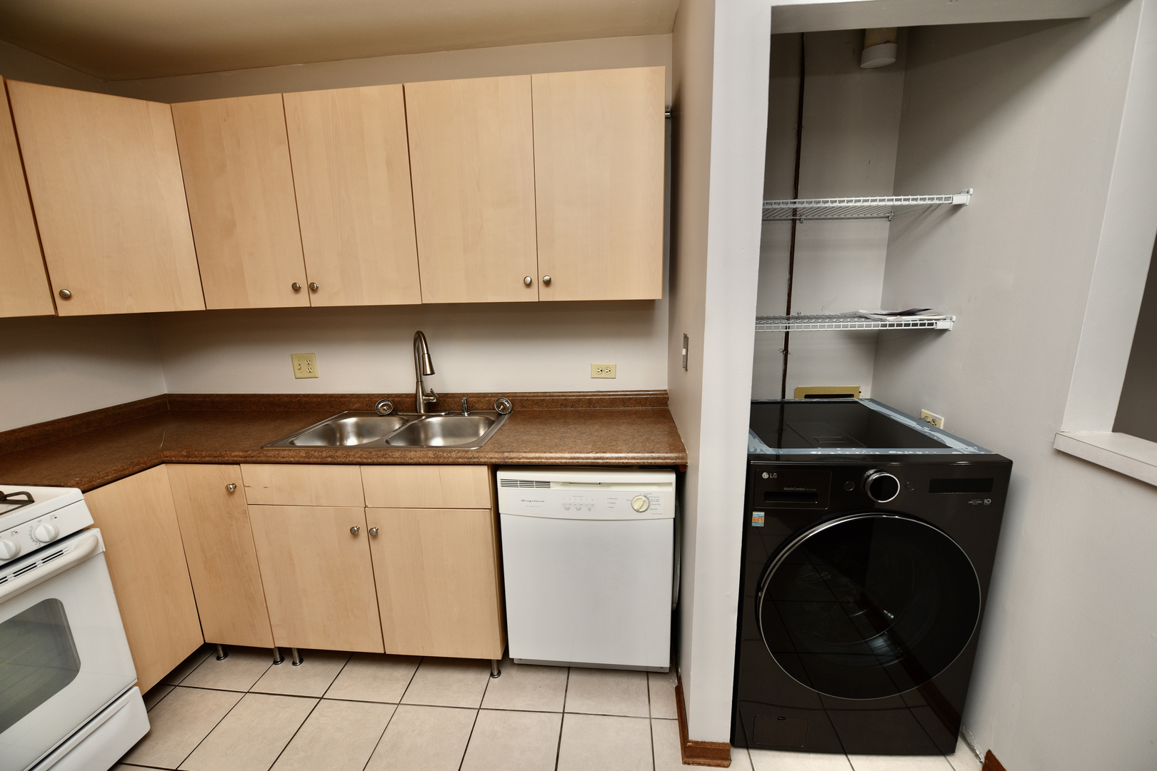 59 Gant Circle, Unit F Streamwood, IL 60107 - Photo 5 of 18 a kitchen with a stove and a sink