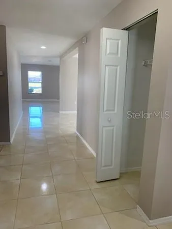 a view of an empty room with a window