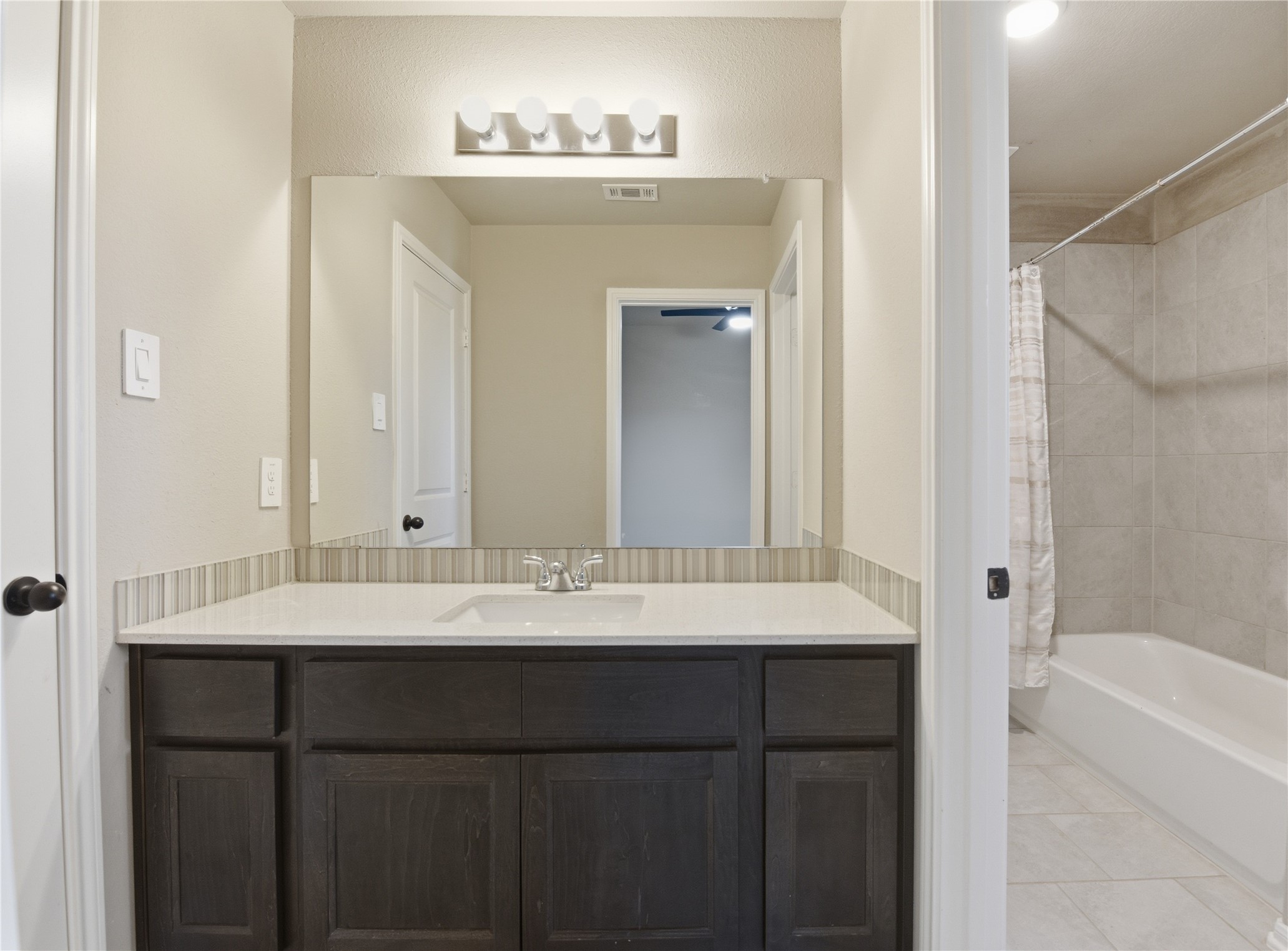 17501 Spice Merlot Lane Conroe, TX 77302 - Photo 47 of 50 a bathroom with a sink and a mirror