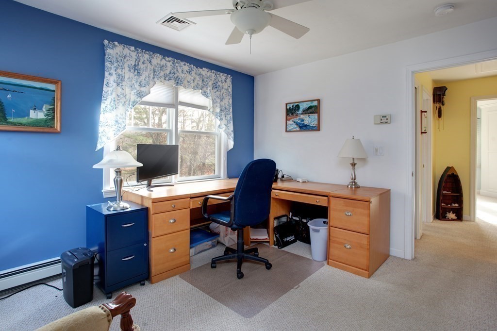 55 Pond Circle Mashpee, MA 02649 - Photo 16 of 40 a view of a workspace with furniture and a window