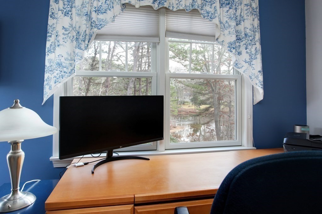 55 Pond Circle Mashpee, MA 02649 - Photo 17 of 40 a room with a large window and wooden floor
