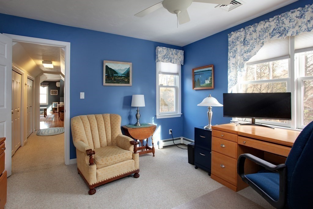 55 Pond Circle Mashpee, MA 02649 - Photo 18 of 40 a bedroom with furniture and a flat screen tv