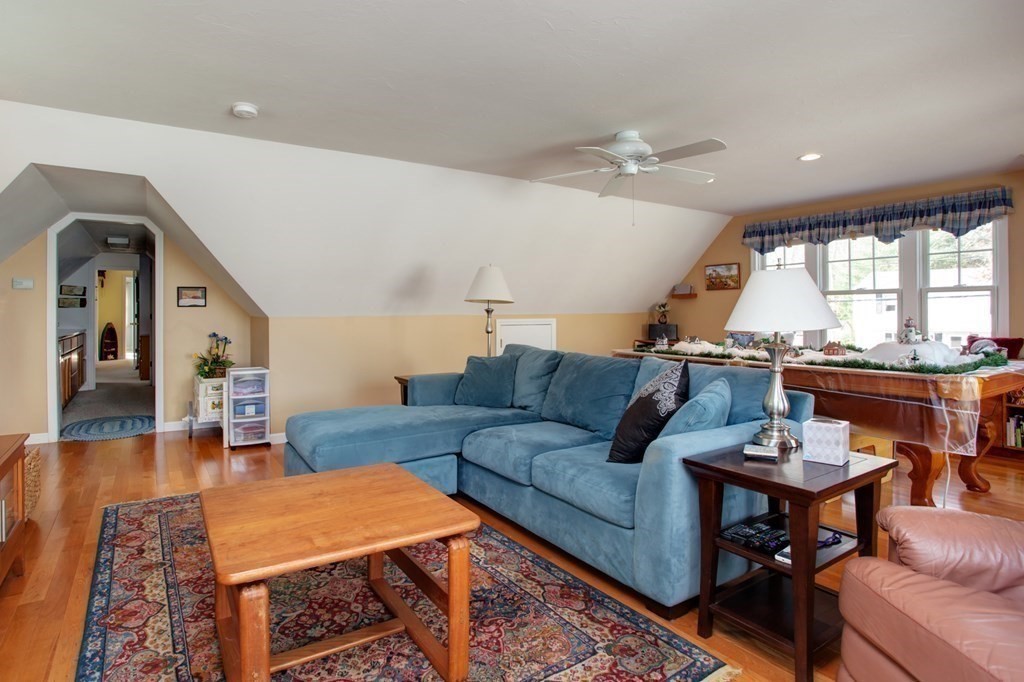 55 Pond Circle Mashpee, MA 02649 - Photo 20 of 40 a living room with furniture and wooden floor