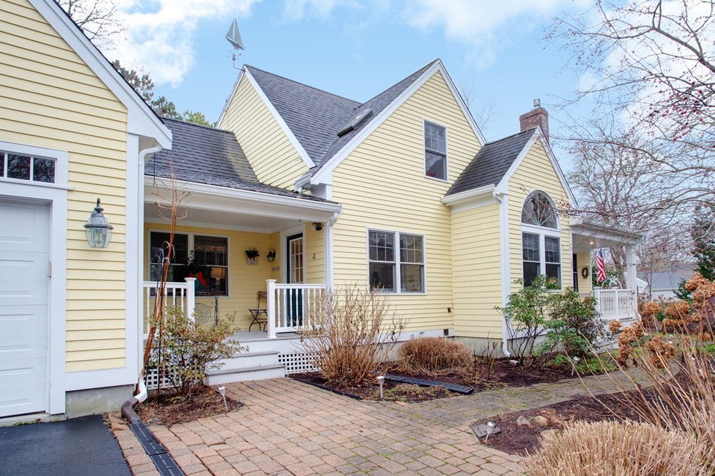55 Pond Circle Mashpee, MA 02649 - Photo 2 of 40 a front view of a house
