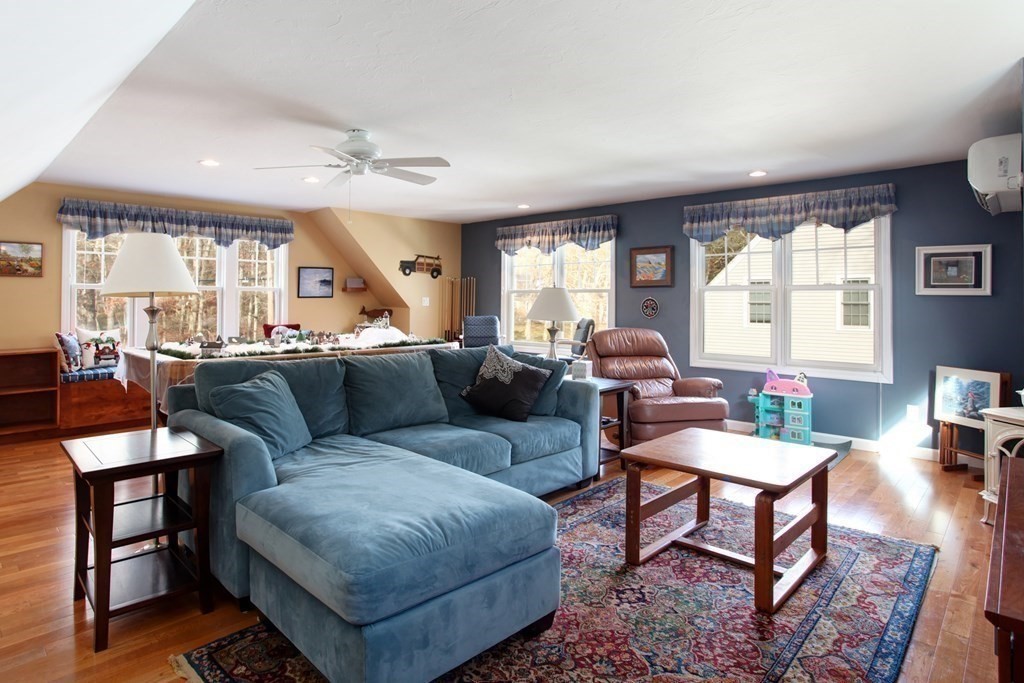 55 Pond Circle Mashpee, MA 02649 - Photo 21 of 40 a living room with furniture and a large window
