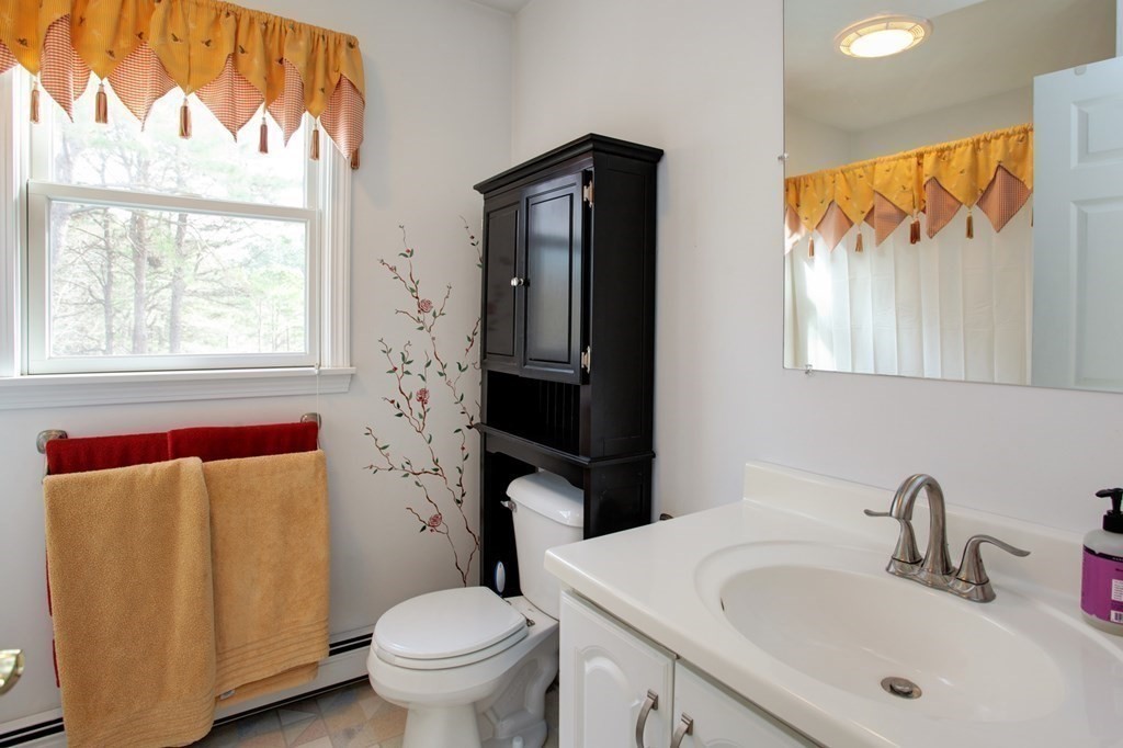 55 Pond Circle Mashpee, MA 02649 - Photo 23 of 40 a bathroom with a sink and a toilet