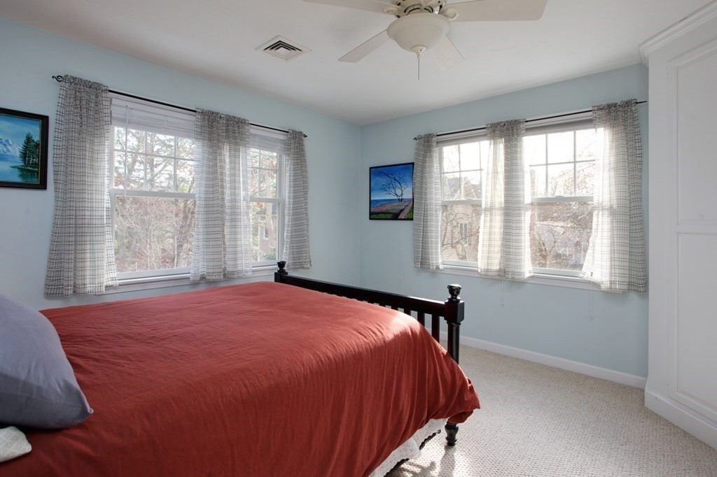 55 Pond Circle Mashpee, MA 02649 - Photo 24 of 40 a bedroom with a bed and a window