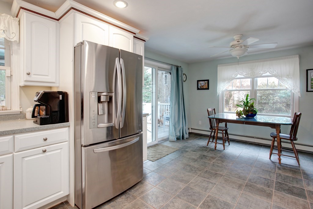 55 Pond Circle Mashpee, MA 02649 - Photo 6 of 40 a kitchen with stainless steel appliances granite countertop a refrigerator and a cabinets