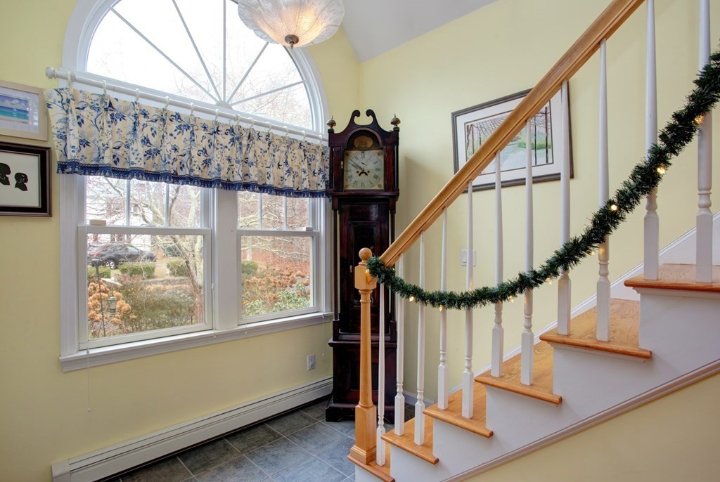 55 Pond Circle Mashpee, MA 02649 - Photo 8 of 40 a view of entryway with wooden floor and a front door