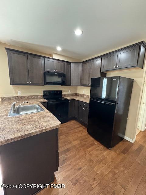 106 Ridgeway Street East Stroudsburg, PA 18301 - Photo 2 of 8 a kitchen with stainless steel appliances granite countertop a refrigerator a sink a stove a microwave and wooden cabinets