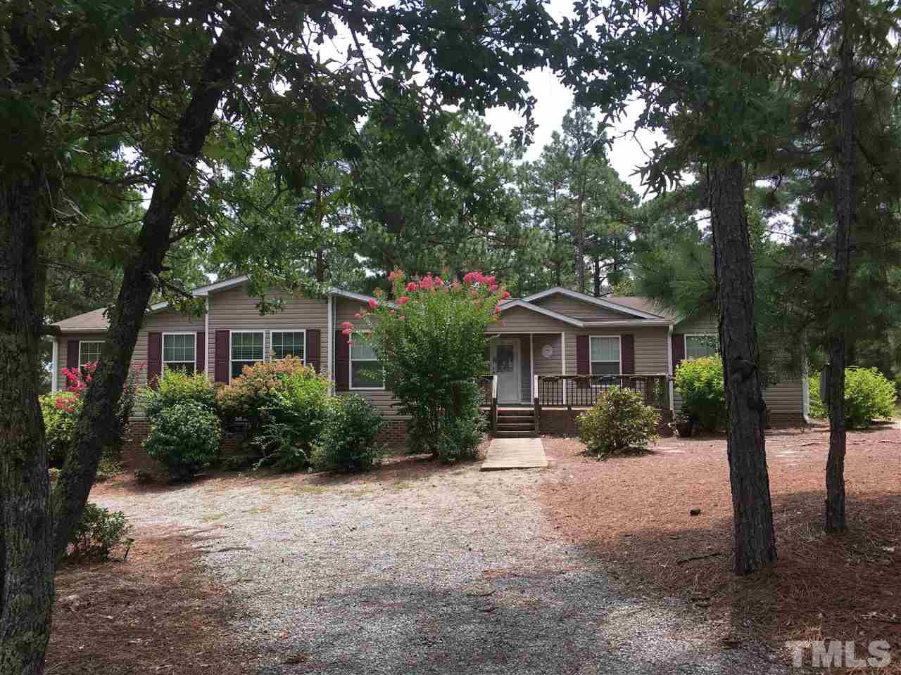 41 Ridge View Drive Cameron, NC 28326 - Photo 1 of 24 Nice wooded lot with flowering bushes to welcome you home.