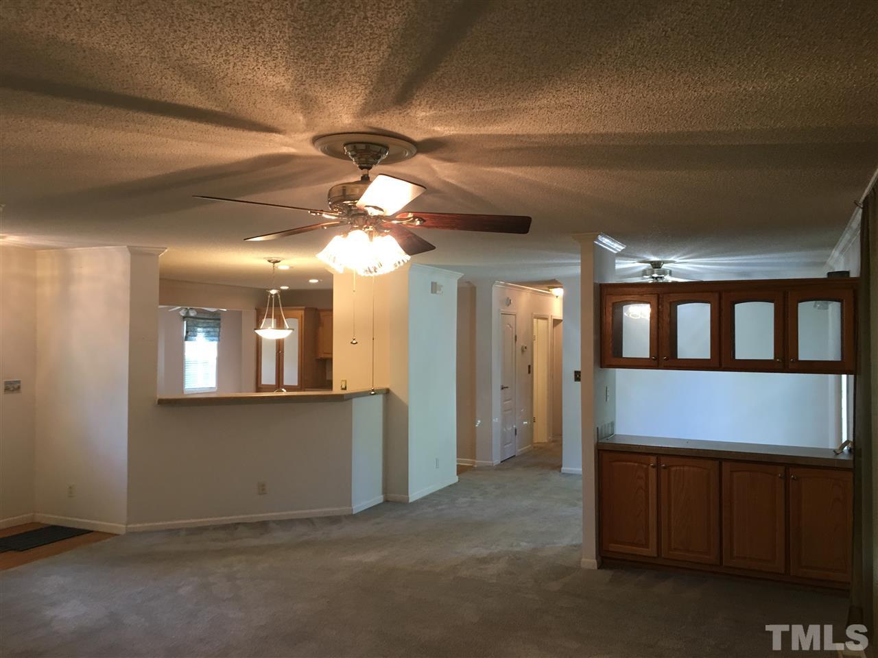 41 Ridge View Drive Cameron, NC 28326 - Photo 7 of 24 Bar area separates the living and dining room.