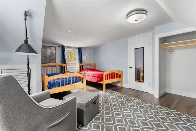 a bedroom with furniture and window