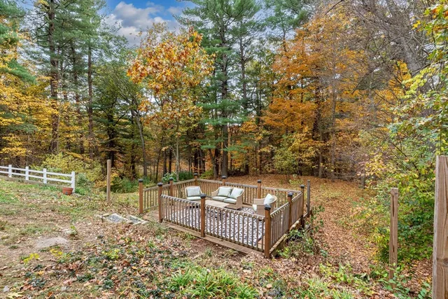 a view of a brick wall with iron fence