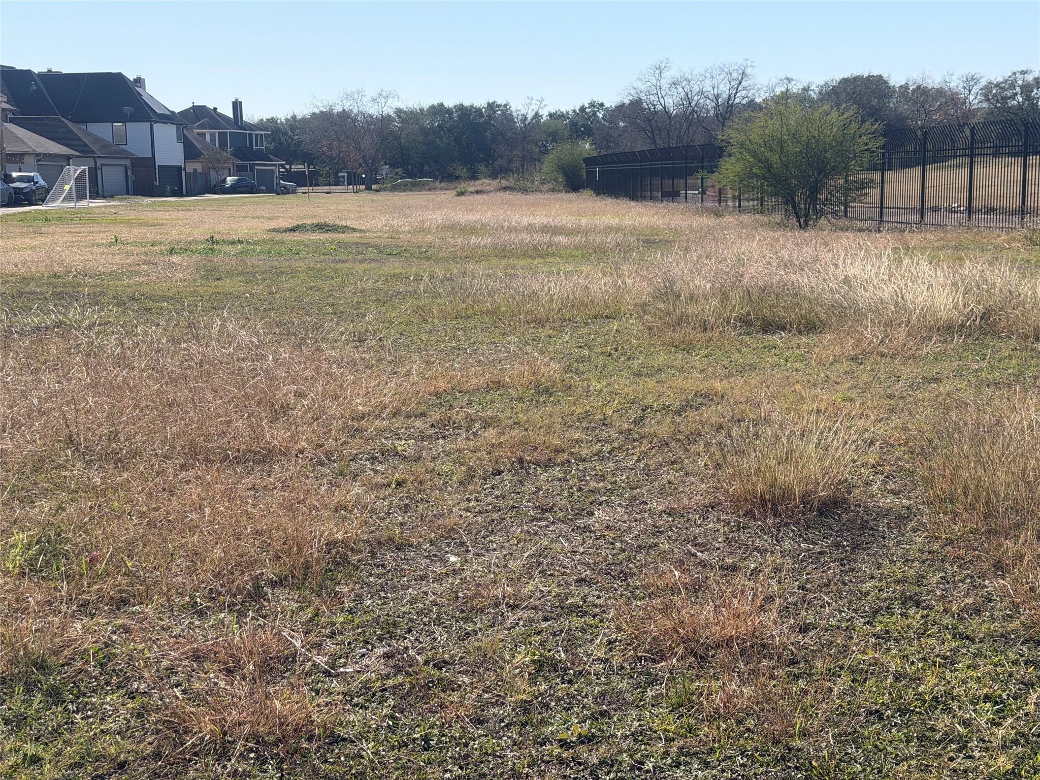0 Rustling Leaves Drive Houston, TX 77083 - Photo 4 of 11 a view of a field with a tree in the background