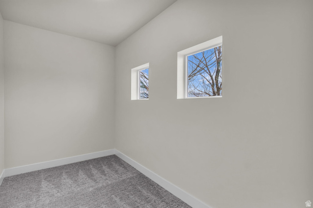 576 7th Avenue Midvale, UT 84047 - Photo 23 of 32 Carpeted spare room featuring baseboards