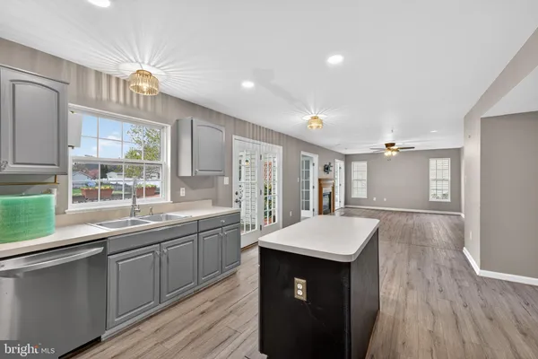 a kitchen with a refrigerator and a sink