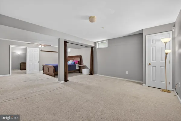 a bedroom with furniture and storage