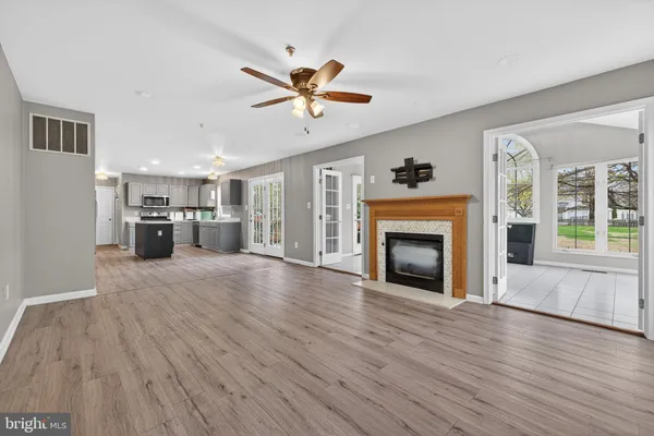 a kitchen with stainless steel appliances granite countertop a stove top oven and cabinets