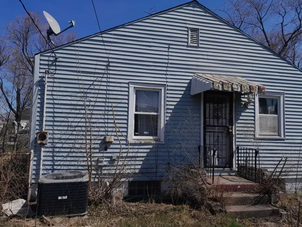 a front view of a house with a garage