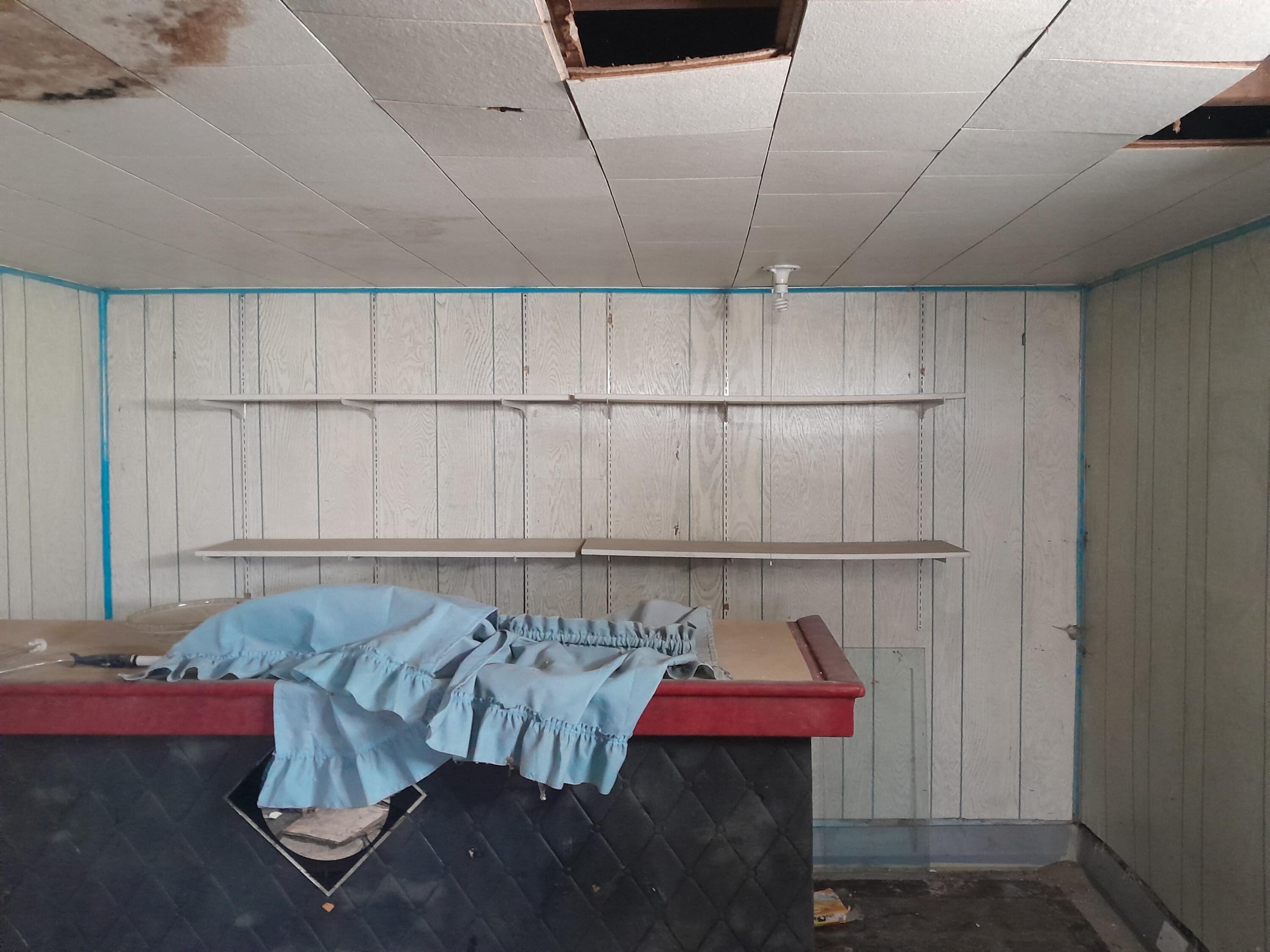 266 Johnson Street Gary, IN 46404 - Photo 11 of 16 a living room with a couch and a table