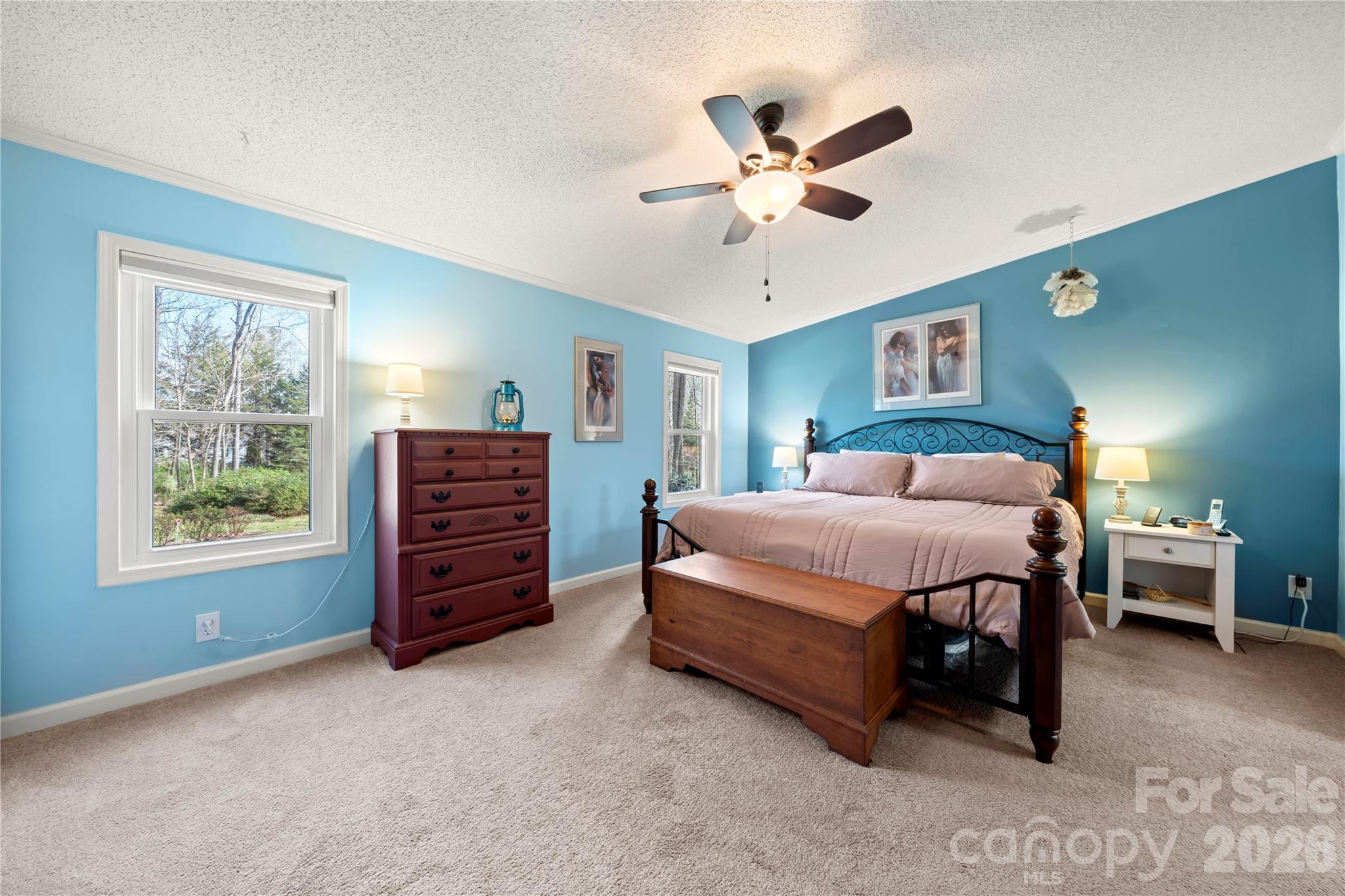 230 Valley View Drive Clover, SC 29710 - Photo 25 of 42 a spacious bedroom with a bed and a chandelier