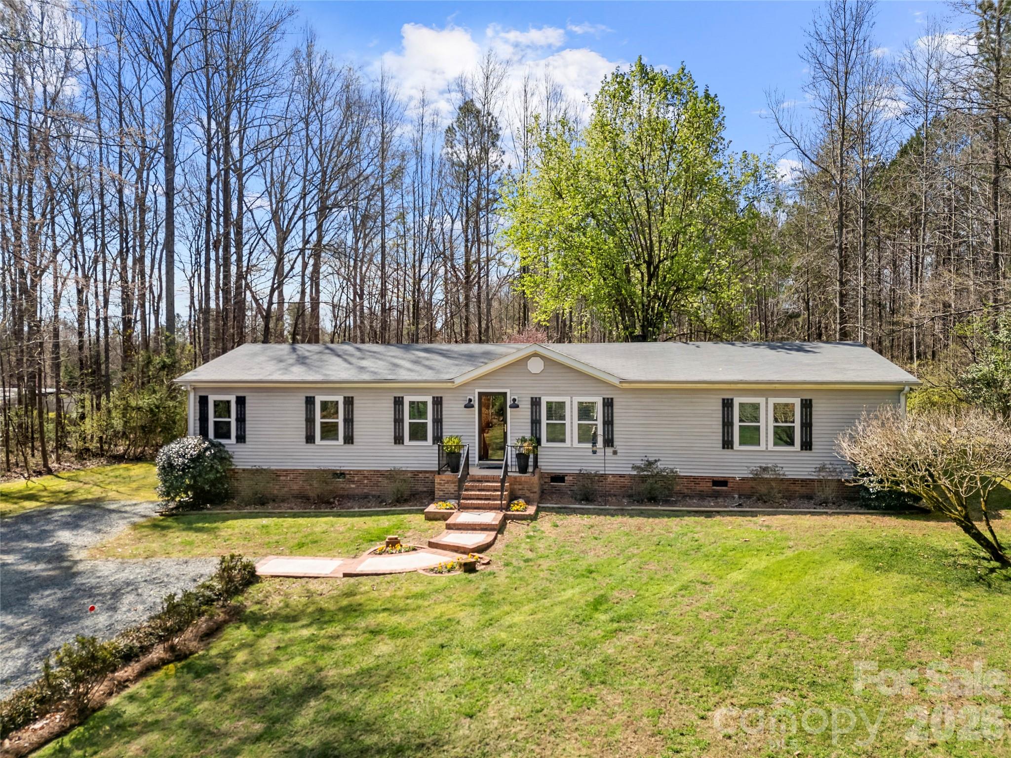 230 Valley View Drive Clover, SC 29710 - Photo 4 of 42 a view of a house with a big yard and large trees