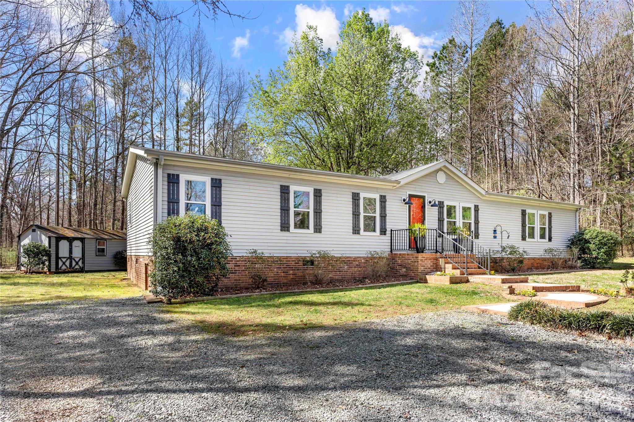 230 Valley View Drive Clover, SC 29710 - Photo 5 of 42 a front view of a house with yard and lake view